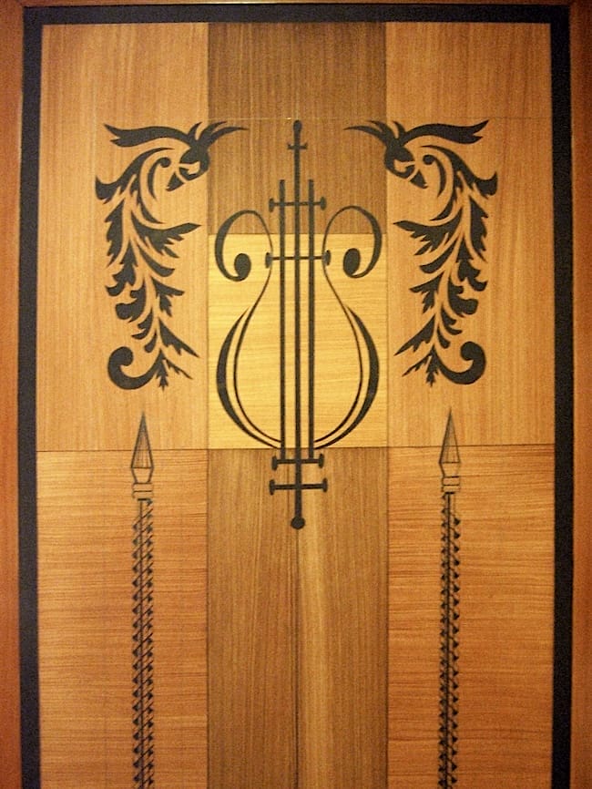 Detail of faux wood inlays and stencil decoration on sliding door-Zannetti jewellery store-Italy 2011